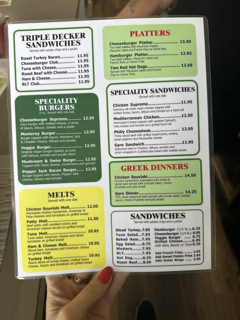 Menu page showing seafood and sandwiches.